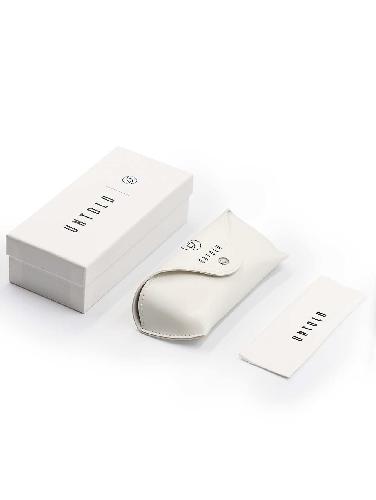 White box and sunglasses packaging with 'UNTOLD' branding on a white background