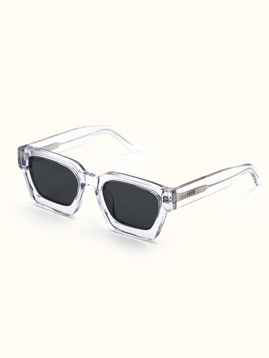 Clear frame sunglasses with black lenses on a white background