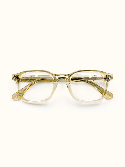 Gold-framed eyeglasses on a white background