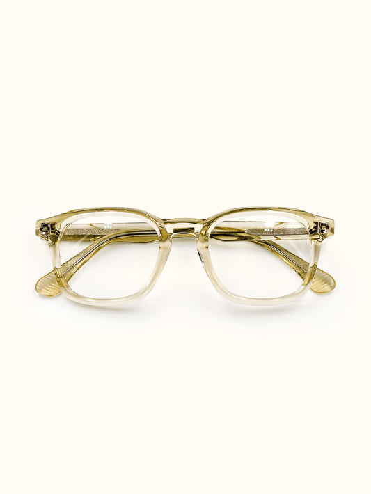 Gold-framed eyeglasses on a white background