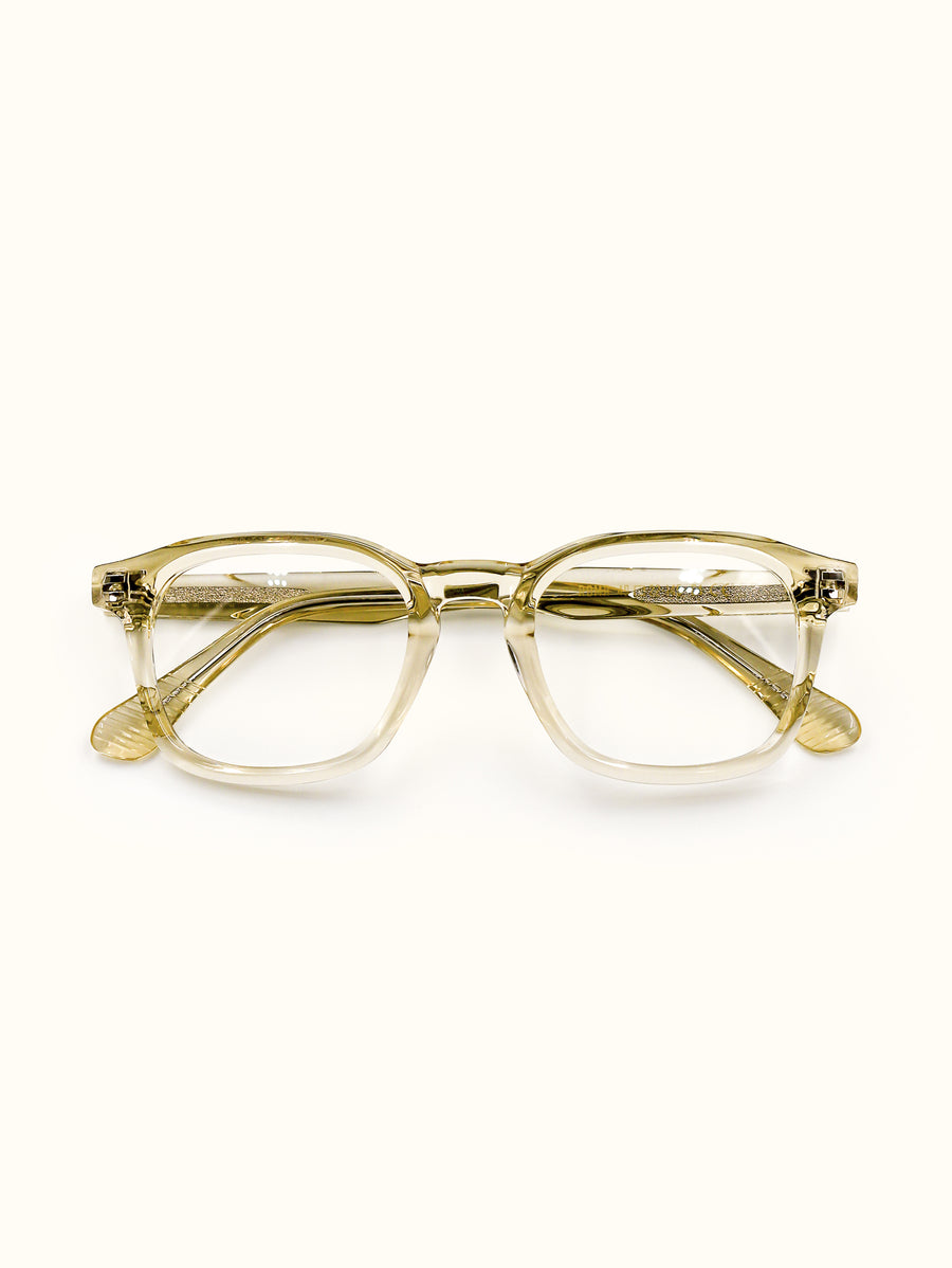 Gold-framed eyeglasses on a white background
