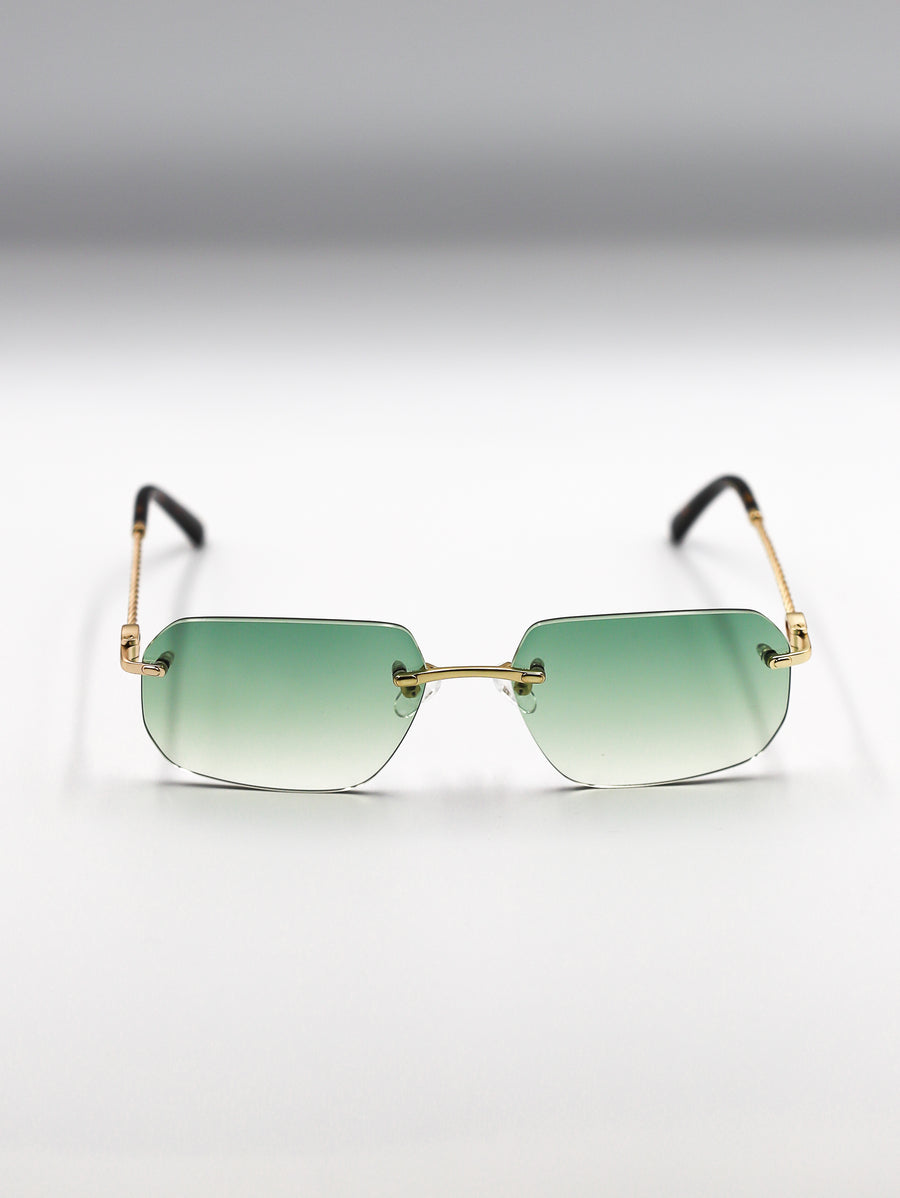Sunglasses with gold frame and green gradient lenses on a light gray background