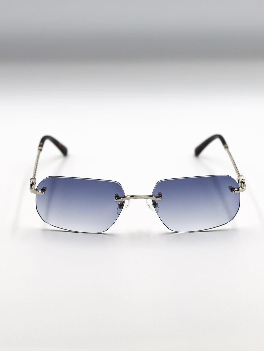 Sunglasses with gradient blue lenses on a light gray background