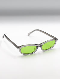 Thumbnail for Sunglasses with green lenses and clear frames on a gradient background