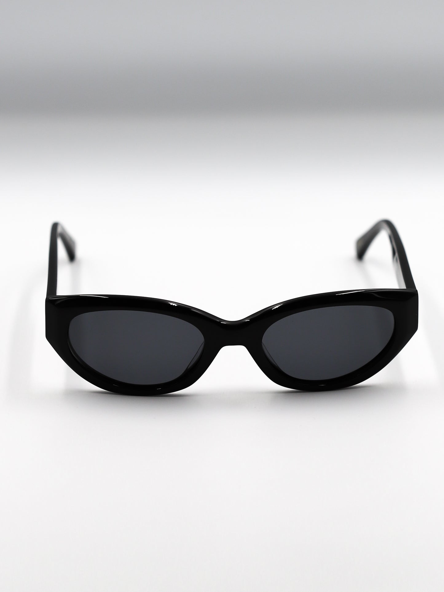Black cat-eye sunglasses on a white background