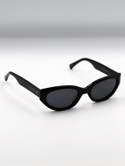 Black sunglasses on a gradient gray background