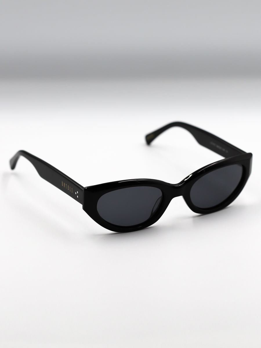 Black sunglasses on a gradient gray background
