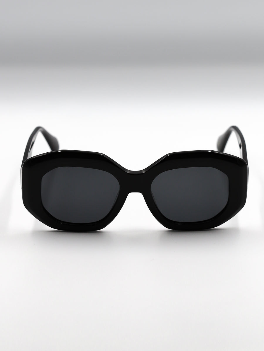 Black sunglasses with a cat-eye design on a white background