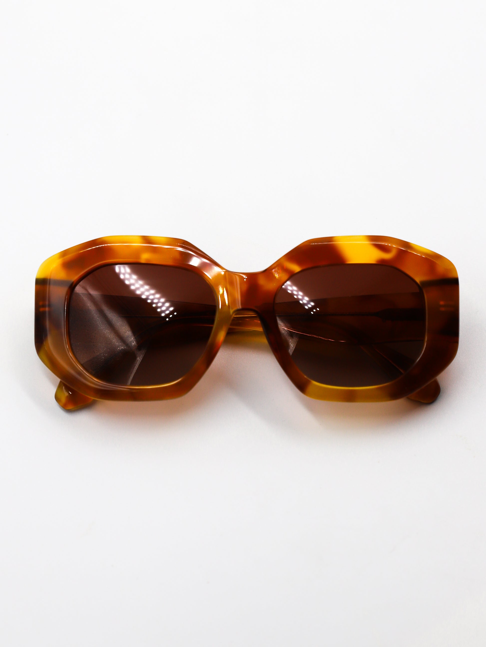 Tortoiseshell sunglasses on a white background