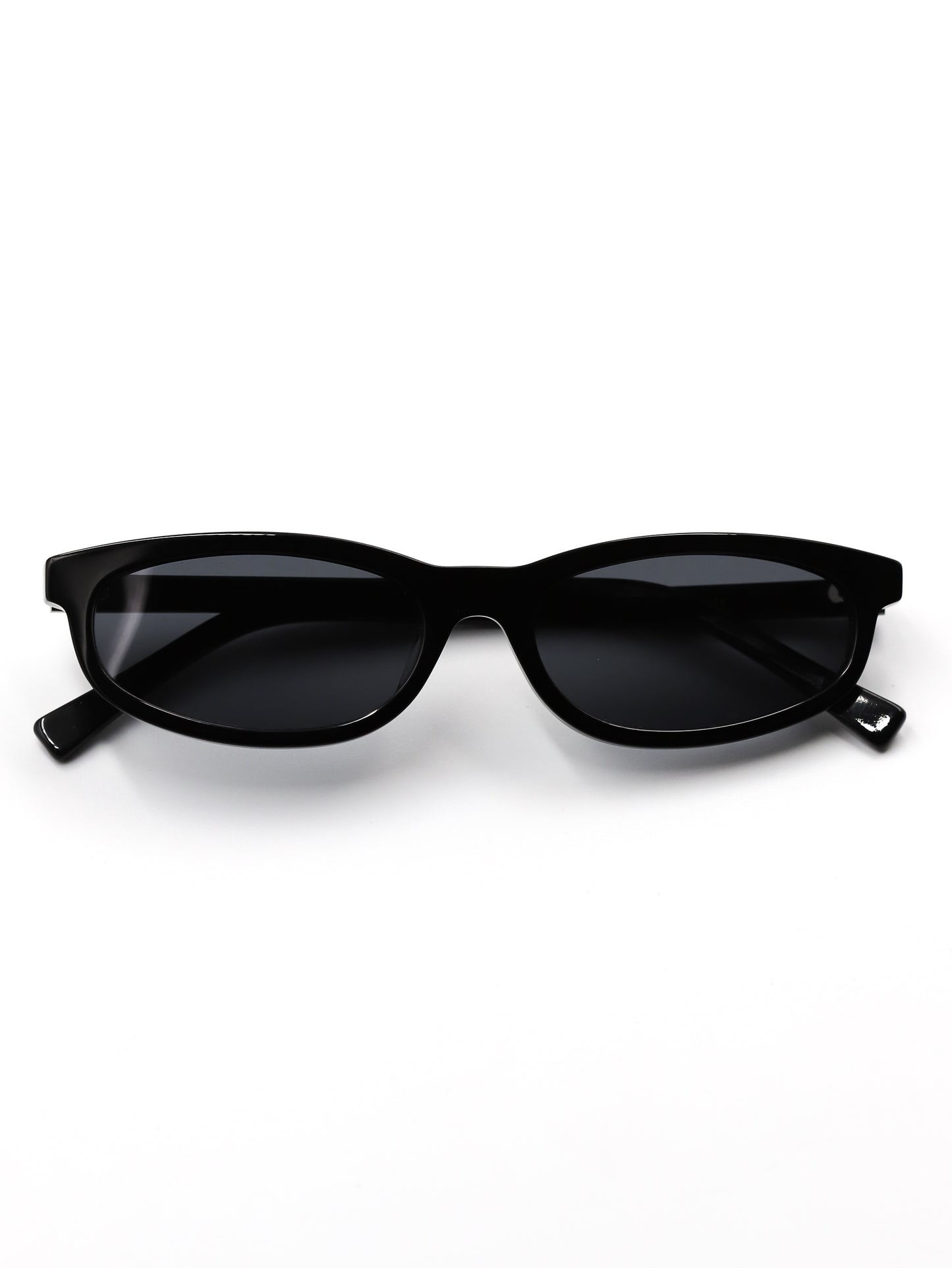 Black cat-eye sunglasses on a white background