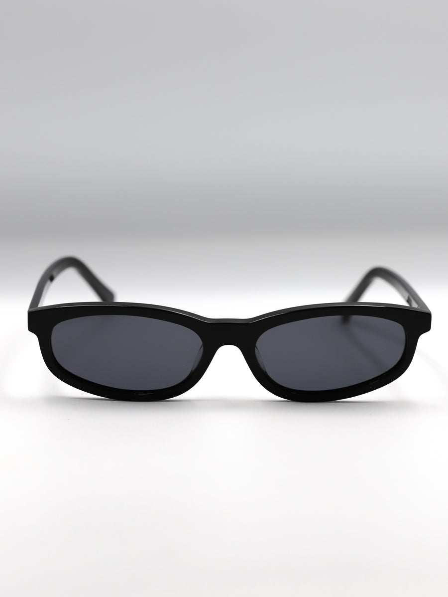 Black sunglasses on a light gray background