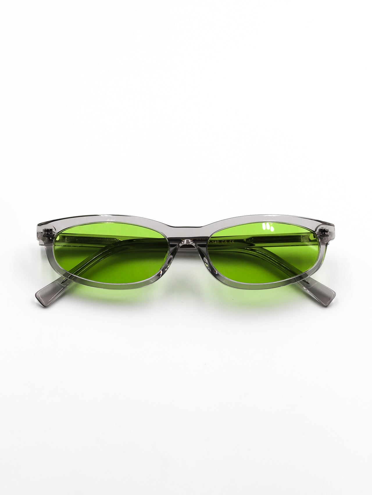 Sunglasses with green lenses and gray frames on a white background