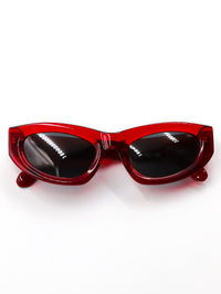 Thumbnail for Red sunglasses with black lenses on a white background
