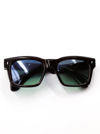 Thumbnail for Black sunglasses with reflective lenses on a white background