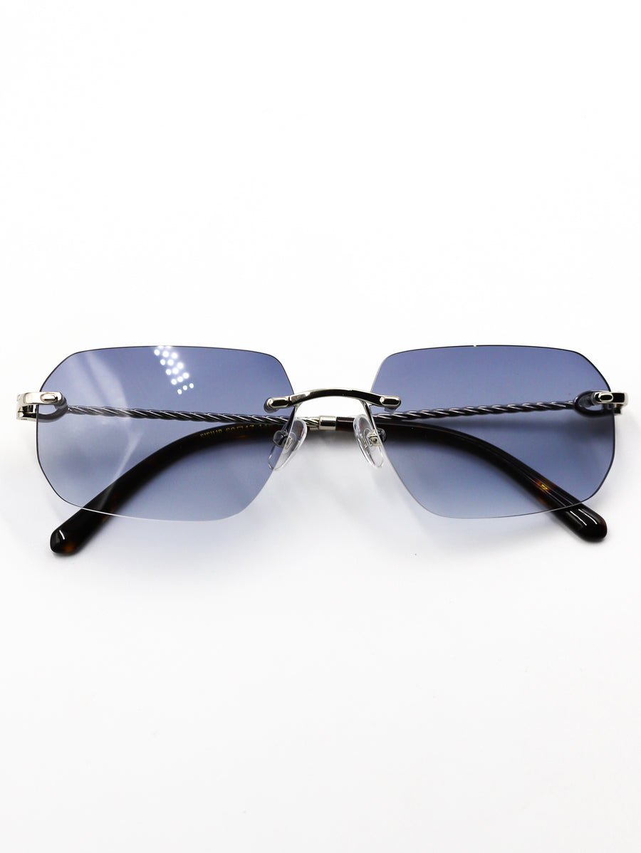 Sunglasses with blue gradient lenses and braided temple design on a white background