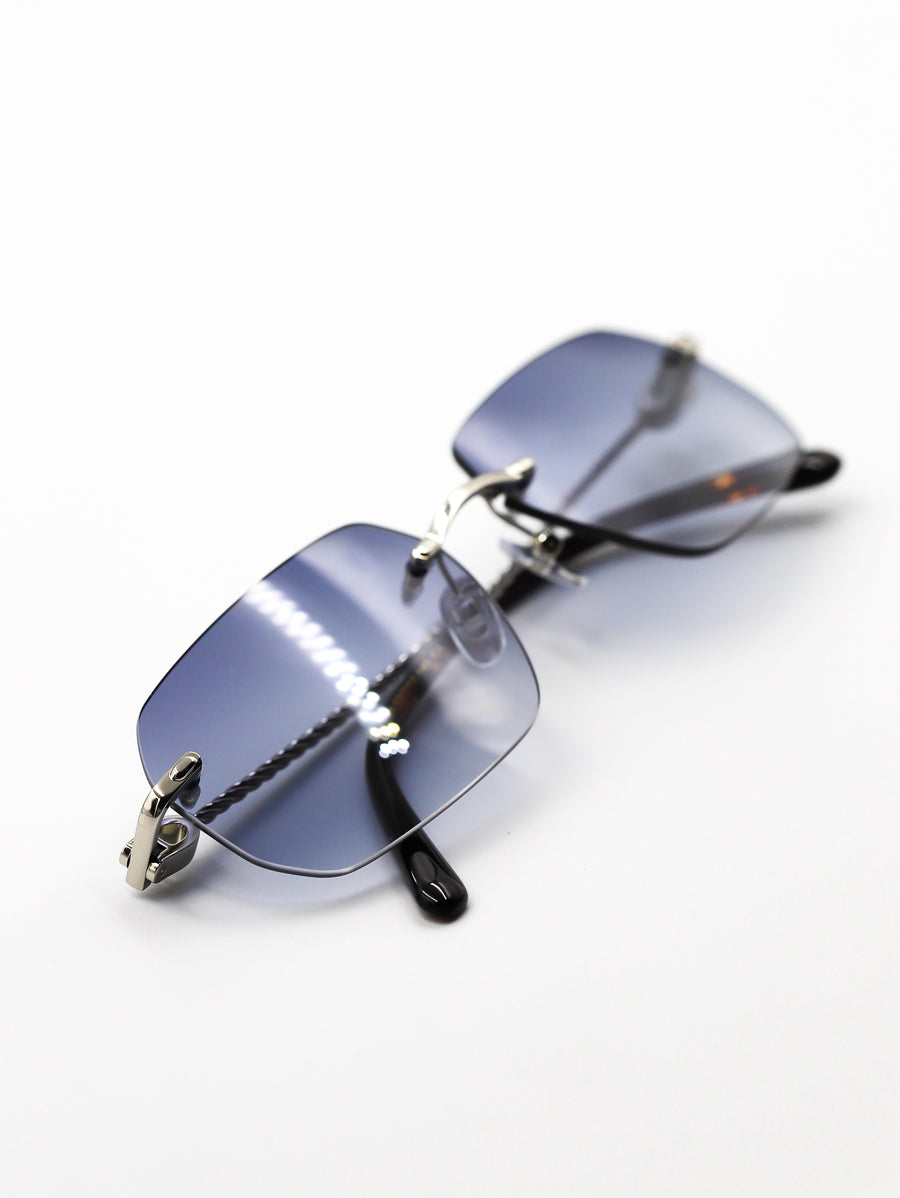 Sunglasses with blue lenses and black frames on a white background
