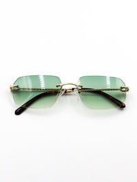 Thumbnail for Sunglasses with green gradient lenses and gold frame on a white background