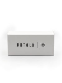 Thumbnail for White box with 'UNTOLD' branding on a white background