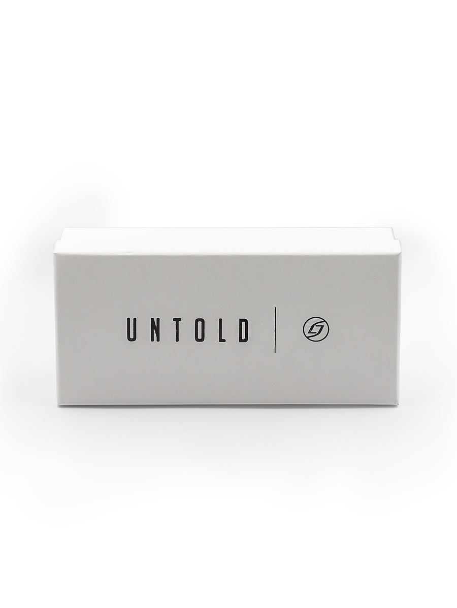 White box with 'UNTOLD' branding on a white background