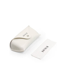 Thumbnail for UNTOLD branding on a card and packaging on a reflective surface with blurred background