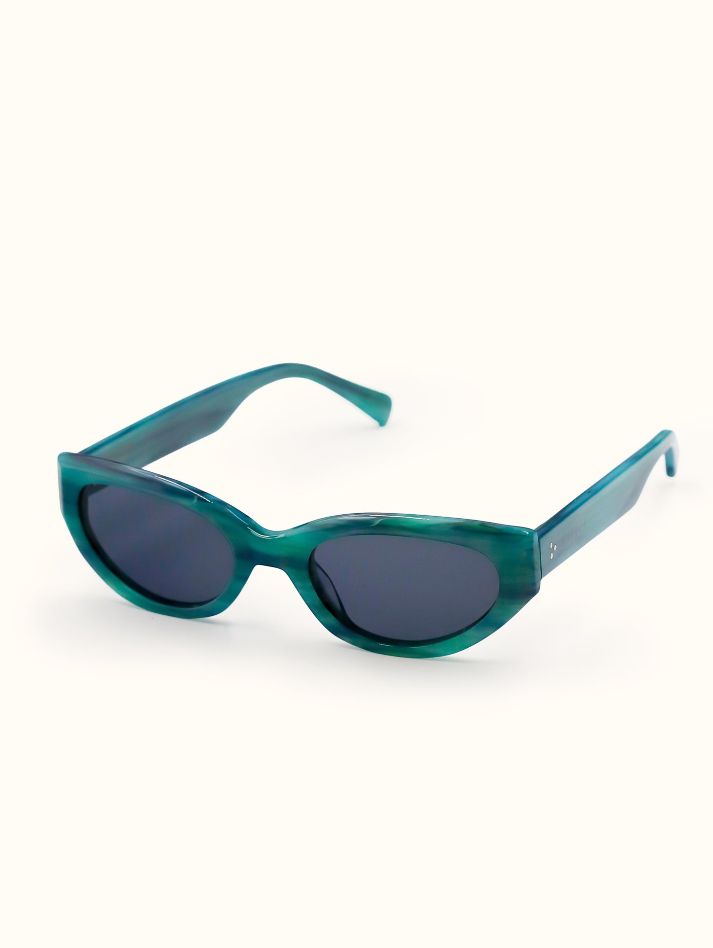 Teal sunglasses with dark lenses on a white background
